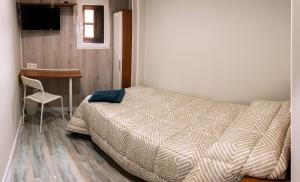 A bed or beds in a room at Apartamento La Campanina