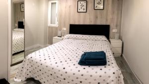A bed or beds in a room at Apartamento La Campanina