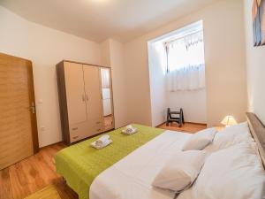 Ein Bett oder Betten in einem Zimmer der Unterkunft Apartment Renata