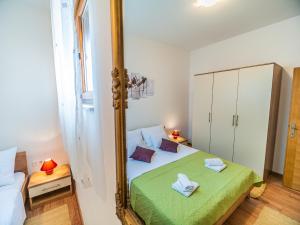 Ein Bett oder Betten in einem Zimmer der Unterkunft Apartment Renata