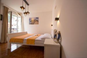 a small bedroom with a bed in a room at Villa DiEden in Budva