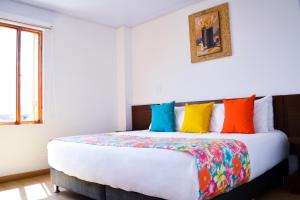 Voodi või voodid majutusasutuse Hotel Cacique Real toas