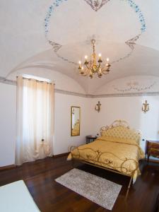 Palazzo Rosati tesisinde bir odada yatak veya yataklar