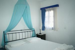 Ένα ή περισσότερα κρεβάτια σε δωμάτιο στο VIlla Antoniadis