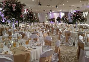 a large banquet hall with white tables and chairs at Bally's Lake Tahoe Casino Resort in Stateline