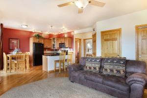 a living room with a couch and a kitchen at Chiefs Head Peak 21B Condo in Estes Park
