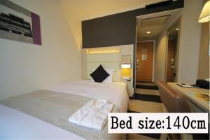 Postel nebo postele na pokoji v ubytování Hotel Sunroute Stellar Ueno