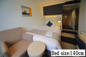 เตียงในห้องที่ Hotel Sunroute Stellar Ueno