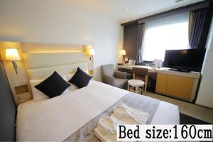 Postel nebo postele na pokoji v ubytování Hotel Sunroute Stellar Ueno