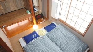 Postel nebo postele na pokoji v ubytování GUEST HOUSE SaKURa