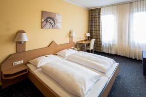 Postel nebo postele na pokoji v ubytování Central Hotel