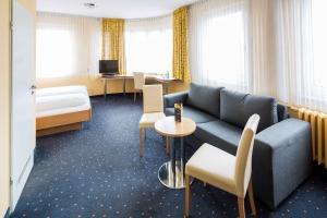 Postel nebo postele na pokoji v ubytování Central Hotel