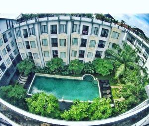 an overhead view of a building with a swimming pool at Umalas Apartment in Seminyak
