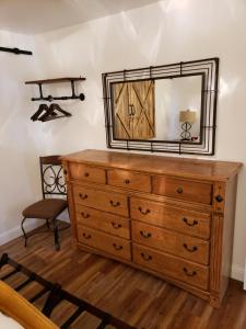 a dresser with a mirror on top of it at Yosemite Foothill Retreat - Private Guest Suite #3 in Coarsegold