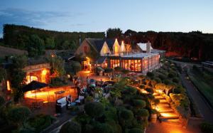an aerial view of a large building with lights at Mudbrick Cottages in Oneroa