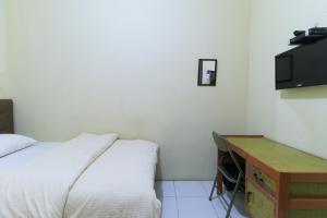 Katil atau katil-katil dalam bilik di Guest House Samarinda