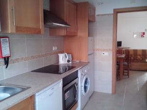 A kitchen or kitchenette at Apartment with 1 Bedroom D
