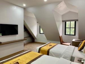 Ένα ή περισσότερα κρεβάτια σε δωμάτιο στο Emma Hotel +30 φωτογραφίες