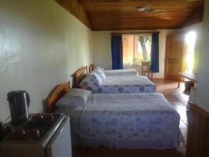 Voodi või voodid majutusasutuse Hotel Taura'a toas