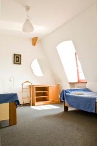 Ein Bett oder Betten in einem Zimmer der Unterkunft Pałac Kietlin