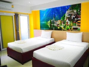 Giường trong phòng chung tại Blue Orchids Hotel