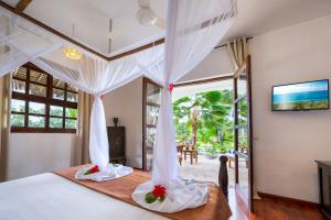Un pat sau paturi într-o cameră la Next Paradise Boutique Resort +79 fotografii