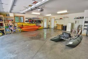 a room with kayaks and kayaks on the floor at Namakagon Landing Condo in Cable +31 photos
