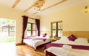 Giường trong phòng chung tại Tam Coc Lavender Homestay