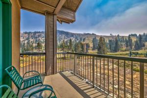 a balcony with chairs and a view of the mountains at L306 Kirkwood Lodge in Kirkwood