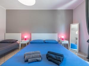 Un pat sau paturi într-o cameră la Spritz Bed & Breakfast