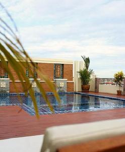 a swimming pool on top of a building at D Apartment in Pattaya Central