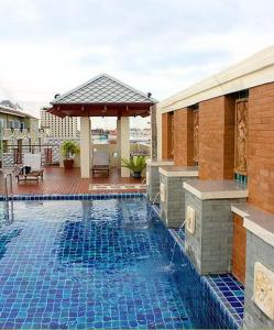 a swimming pool in the middle of a house at D Apartment in Pattaya