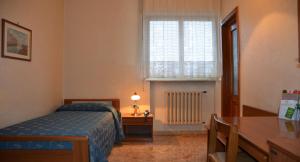 Postel nebo postele na pokoji v ubytování Hotel A-14