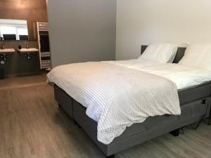 Кровать или кровати в номере Hoeve Oude Tol