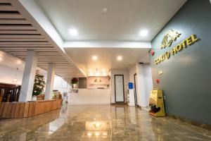 a lobby of a store with a sign on the wall at Cozi 9 Hotel in Hai Phong