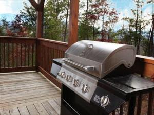 a grill sitting on a deck on a porch at Spacious Party Hut Near Attractions in McCookville