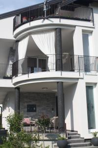 an external view of a building with a balcony at LGP Exclusive Apartment in Bihać