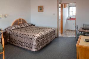 Postel nebo postele na pokoji v ubytování New Haven Motel