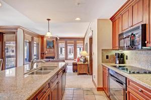 a kitchen with a sink and a counter top at Mc308 Mill Club Condo in Copper Mountain