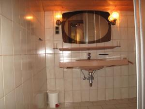 a bathroom with a sink and a mirror at sHoamatl in Pfunds +42 photos