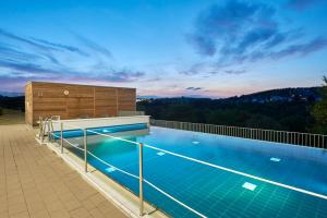 a swimming pool on the roof of a house at Hotel Oversum Winterberg Ski- und Vital Resort in Winterberg