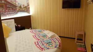 Whole Sunshine International Guest House 객실 침대