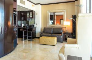 a living room with a couch and a kitchen at Penthouse De Soleil South Beach - on Ocean Drive Miami Beach in Miami Beach +18 photos