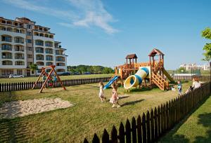 a group of children playing in a playground at Sunrise All Suites Resort- All Inclusive in Obzor