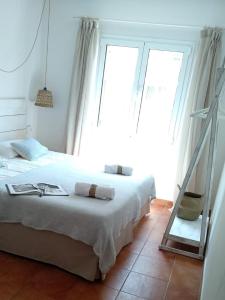 Hostal Sa Posada Set Cales客房内的一张或多张床位