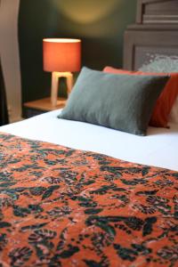 Postel nebo postele na pokoji v ubytování La bohème - Chambres d’hôtes