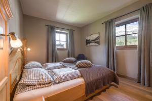 Posteľ alebo postele v izbe v ubytovaní Apartment Enzian