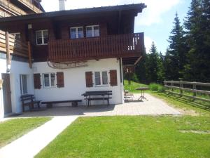 a building with a picnic table in front of it at Chalet Grazia in Riederalp