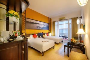 Voodi või voodid majutusasutuse Hoi An Beach Resort toas