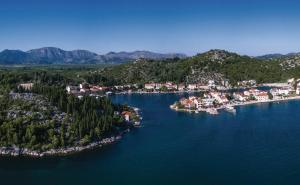 an aerial view of a small island in the water at Apartmani Sršen in Blace